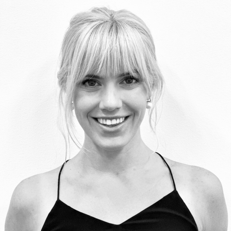 Pilates instructor smiling headshot in black and white