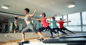 A number of people working out in a gym