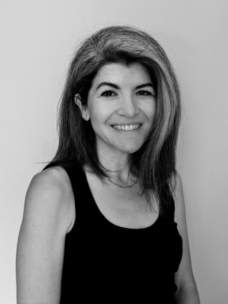 Women smiling in black and white headshot